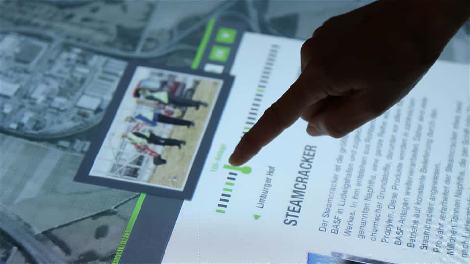 Finger interaction with a timeline-based information panel on the BASF multitouch media table.