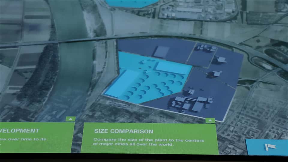Close-up of interactive map layers on the BASF media table, highlighting site areas and size comparison features.