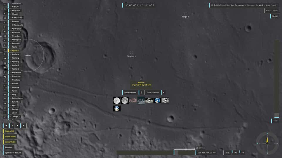 A hand touching the multi-touch table of the Moontable installation, zooming in on a specific area of the moon's surface displayed in 3D, and clicking on a context menu to show additional information about a specific crater, including its dimensions, coordinates, depth, and related imagery and video.